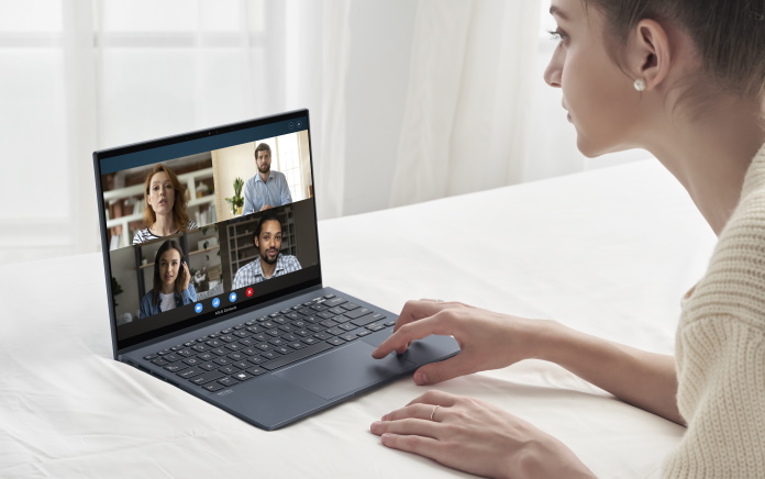 Woman using Zenbook S laptop for video conferencing