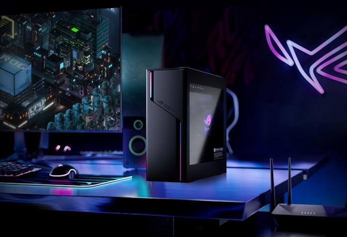 The ROG G22CH gaming desktop on a table with ROG gaming peripherals with a gaming router in the foreground