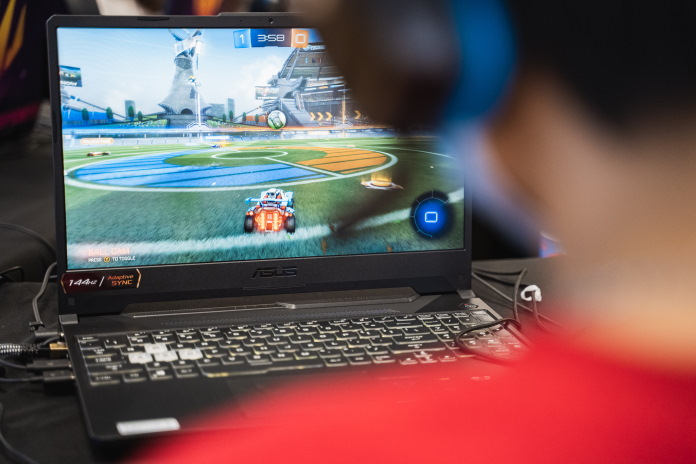 Student using an ASUS laptop to compete in esports 