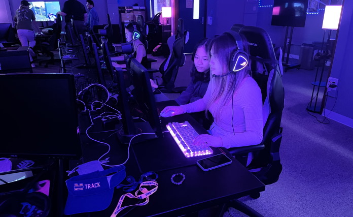 High school student practicing esports with a classmate