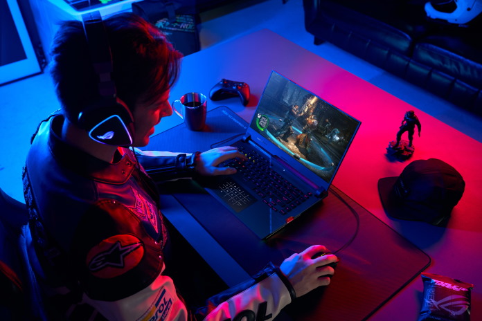Student engaging in competitive gaming using an ROG Strix SCAR 15 gaming laptop