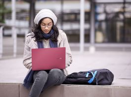 Woman using Resolute Red version of Vivobook S15 S533 laptop