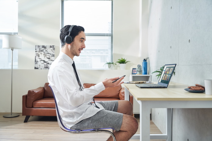 A man giving a presentation from his home office