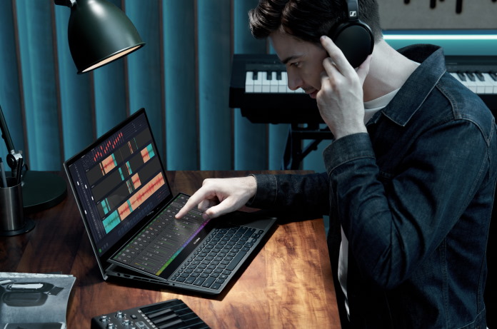 Student using the Zenbook Pro Duo 15 OLED to mix music 