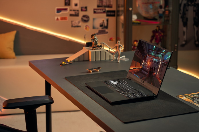 TUF Dash F15 laptop set up in a gaming room