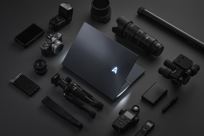 Zenbook Pro laptop with an array of camera equipment surrounding it 