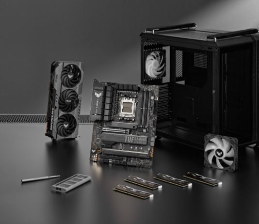 TUF Gaming GT502 chassis on a table with a variety of PC DIY components from TUF Gaming