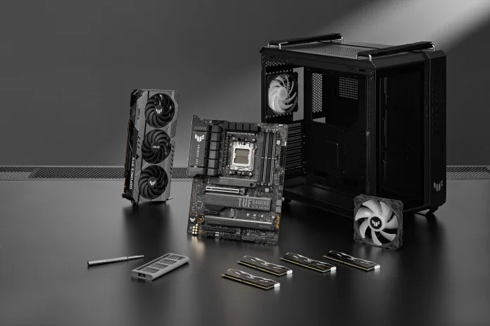 TUF Gaming GT502 chassis on a table with a variety of PC DIY components from TUF Gaming