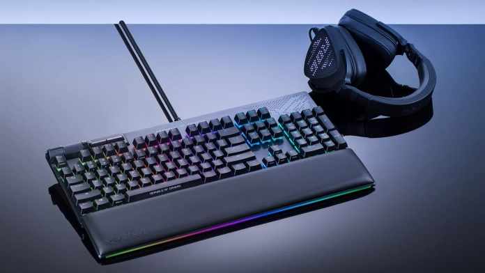 ROG Delta S Animate gaming headset on a table next to the ROG Strix Flare II Animate gaming keyboard