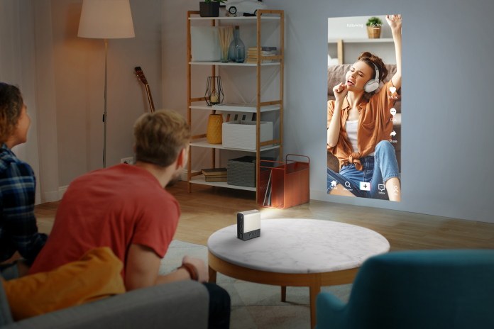 Young people watching vertical video together using the ZenBeam E2 portable projector