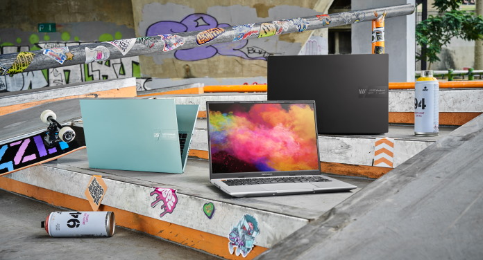 A variety of Vivobook S 14 OLED laptops outside at a skate park