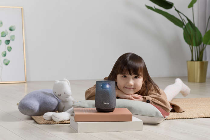 Young girl watching a video using the ZenBeam Latte L1 portable projector