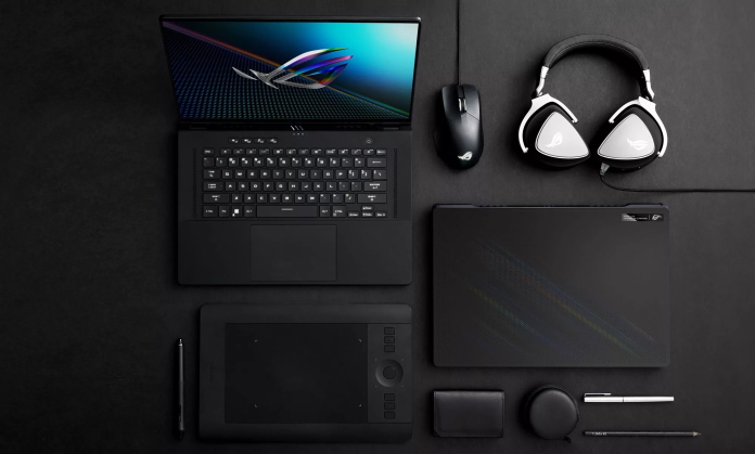 Zephyrus M16 laptop arranged on a desk with a variety of gaming peripherals and tools for content creation