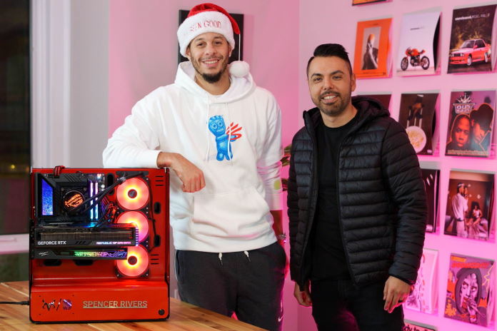 Seth curry admires the finished custom PC build he made for his brother in law