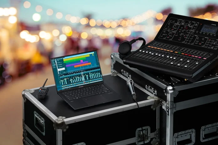The Zenbook Pro 14 OLED laptop used at a concert for audio mixing and recording