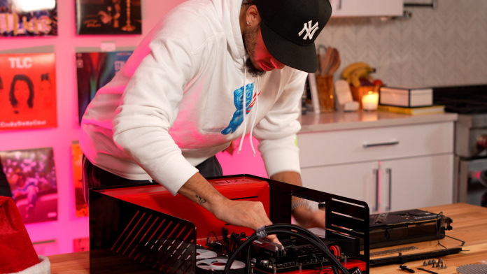 Seth with the PC case laid flat on the table, installing the CPU