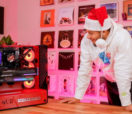 Seth curry admires the finished custom PC build he made for his brother in law