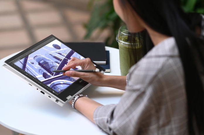 Woman creating digital art on the Chromebook Vibe CX34 Flip using the garaged stylus