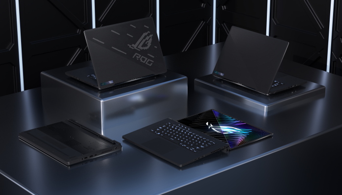 Four ROG Zephyrus M16 gaming laptops arranged in different modes on a table