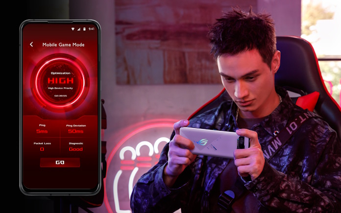 A young man playing games on his smartphone with Mobile Game Mode activated on the router