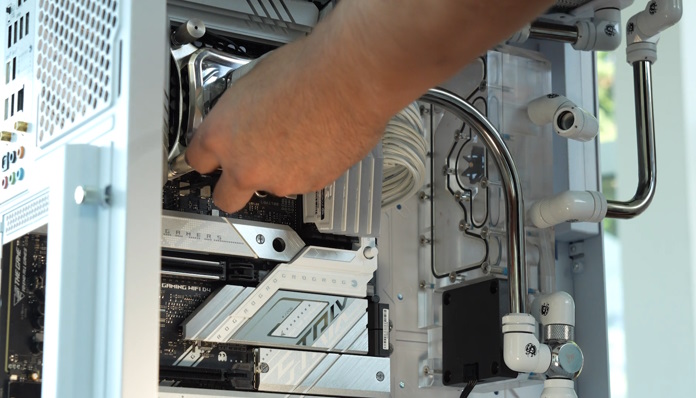 Ben installing the custom-loop CPU cooler with metal tubing