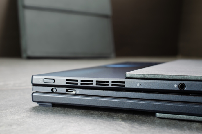 Closeup view of the laptop closed on a table, its ErgoSense keyboard tucked inside