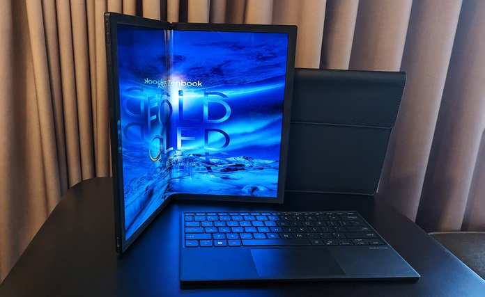 The Zenbook 17 Fold OLED opened in reader mode on a table