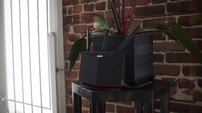 ASUS wireless on an end table against an exposed brick wall