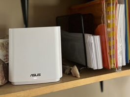 ASUS ZenWiFi XT9 mesh WiFi system on a bookshelf