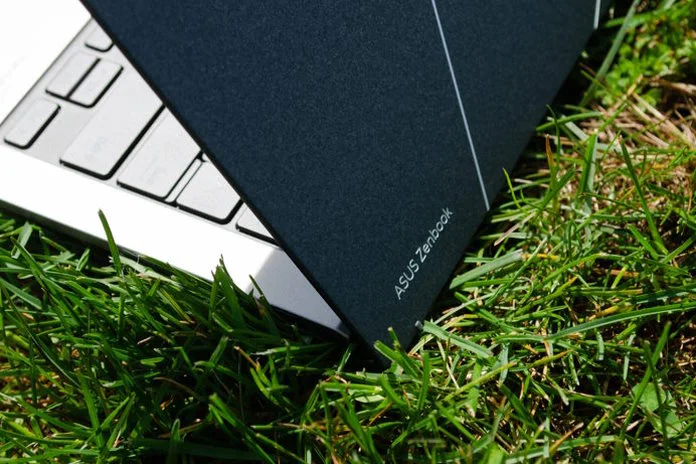 Zenbook S 13 OLED laptop in a field of grass