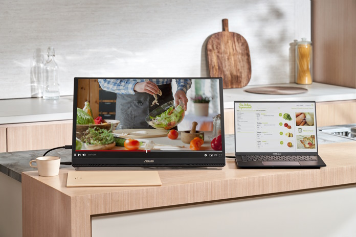 The ASUS ZenScreen MB249C monitor in a kitchen being used to watch a recipe 