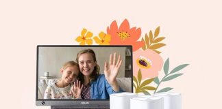 An ASUS portable monitor and a ZenWiFi mesh WiFi system in front of stylized flowers