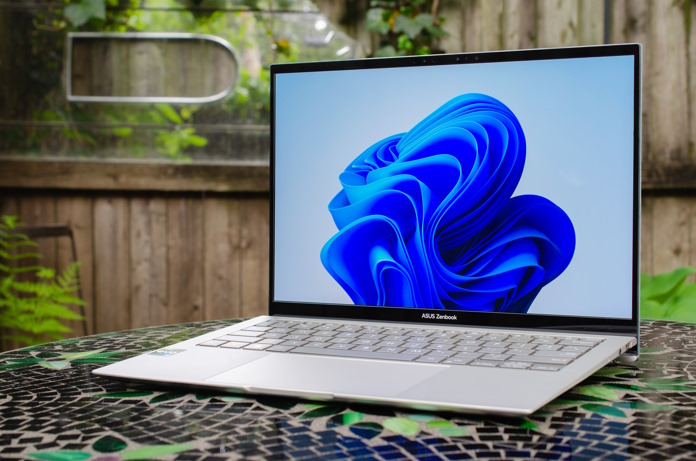 Zenbook S 13 OLED laptop on a table in a garden