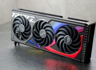 The ROG Strix GeForce RTX 4070 Ti graphics card standing upright on a reflective surface