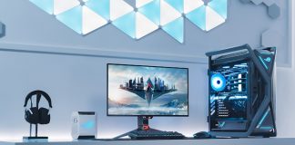 A full ROG gaming setup on a desk with an ROG gaming monitor at the center