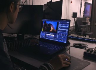 A college student does video editing in a lab using a ProArt Studiobook 16 OLED