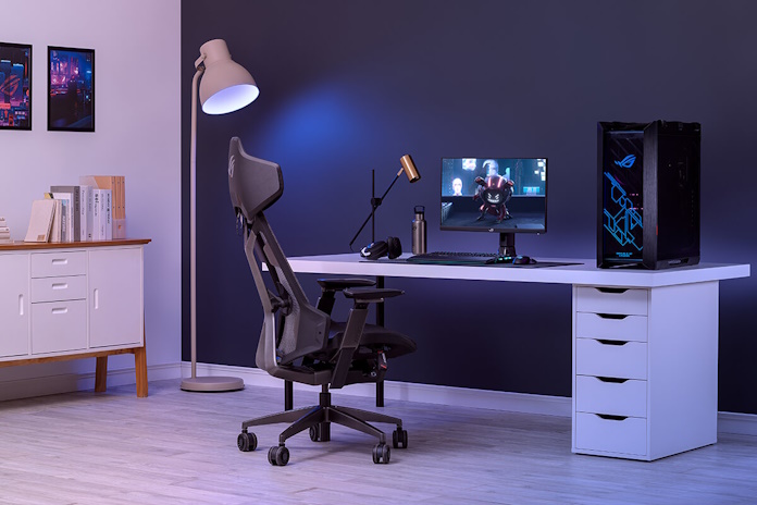A mainstream gaming setup with an ROG desktop PC and gaming chair