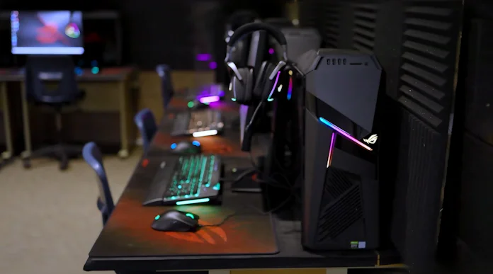 An esports lab setup including the ROG GL12CX desktop, ROG Gladius III gaming mouse. ROG Delta S headset, and ROG Strix Flare keyboard 