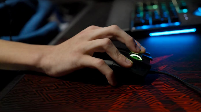A close look at a student using an ROG Gaming mouse