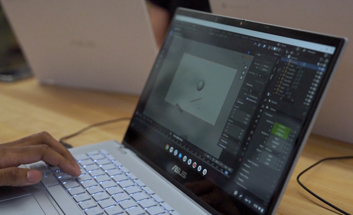 A closeup view of the laptop screen as a student uses a stylus to create art on an ASUS Chromebook CX3 Flip