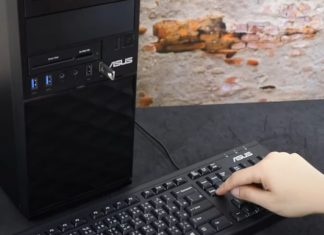 A user pressing delete on their keyboard to enter BIOS