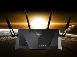 A front view of the ASUS RT-AX88U Pro wireless extendable router with a sunset in the background