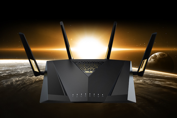 A front view of the ASUS RT-AX88U Pro wireless extendable router with a sunset in the background