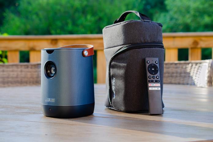 The ASUS ZenBeam L2 portable projector and its included carrying bag and remote control