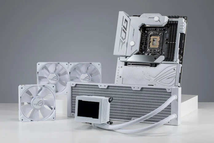 The ROG Maximus Z790 Formula and ROG Ryujin III 360 ARGB White Edition arranged on a table with the fans separated from the radiator