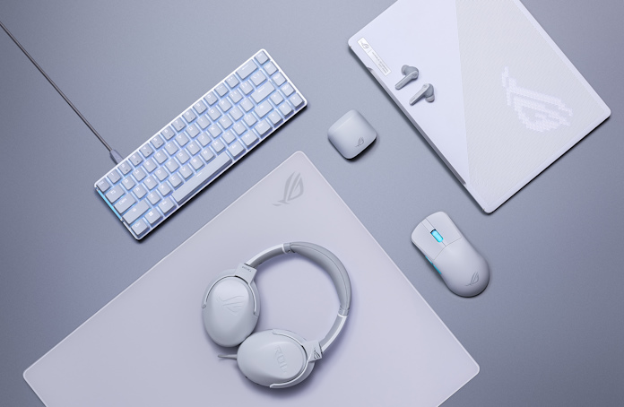 A variety of ROG Moonlight White hardware arranged on a desk from a top-down view 