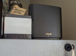 The ZenWiFi XT8 mesh WiFi system on top of a refrigerator