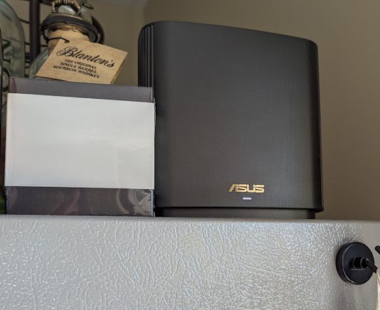 The ZenWiFi XT8 mesh WiFi system on top of a refrigerator