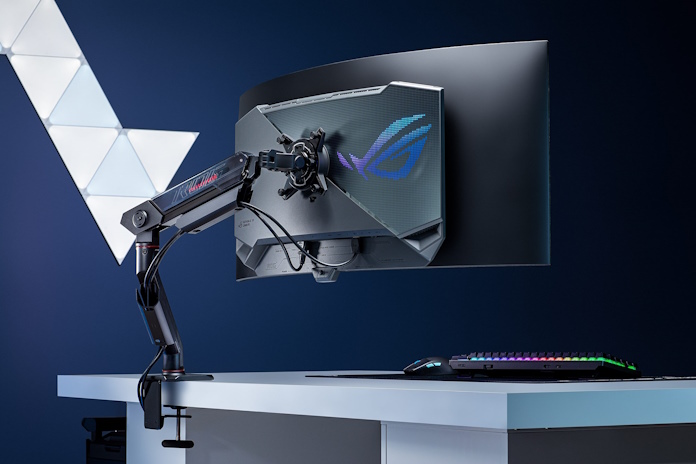 The ROG Swift OLED PG39WCDM gaming monitor attached to a desk using the ROG Ergo Monitor Arm