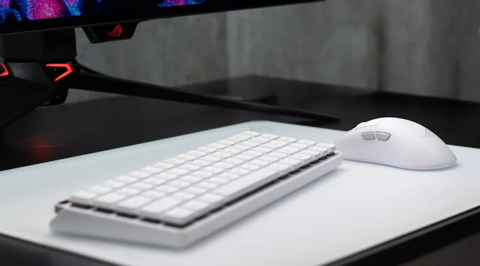 The ROG Falchion RX Low Profile keyboard and ROG Keris II Ace gaming mouse on a gaming desk 